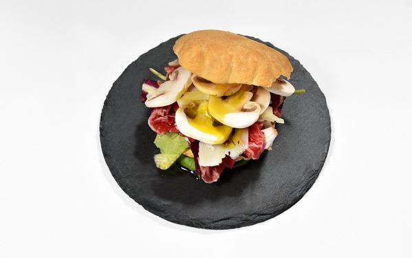 Puff pastry sandwich with angus beef carpaccio, slivered mushrooms and pecorino