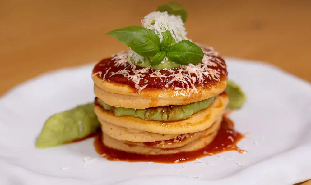 Savory pancake, tomato sauce, feta cheese and avocado